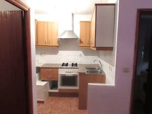 Cocina con horno, placa y campana