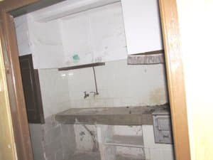Cocina antigua con pila de obra