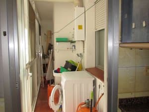 Galería con lavadora y termo