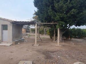 Casa de campo con porche de pérgola