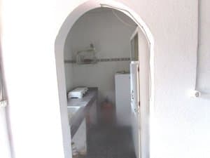 Paso en arco hacia la cocina